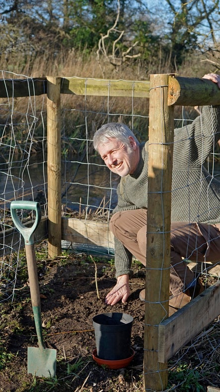 Adam Curtis of the Tree Council at the planting of the walnut tree, John's Water, Blickling Estate